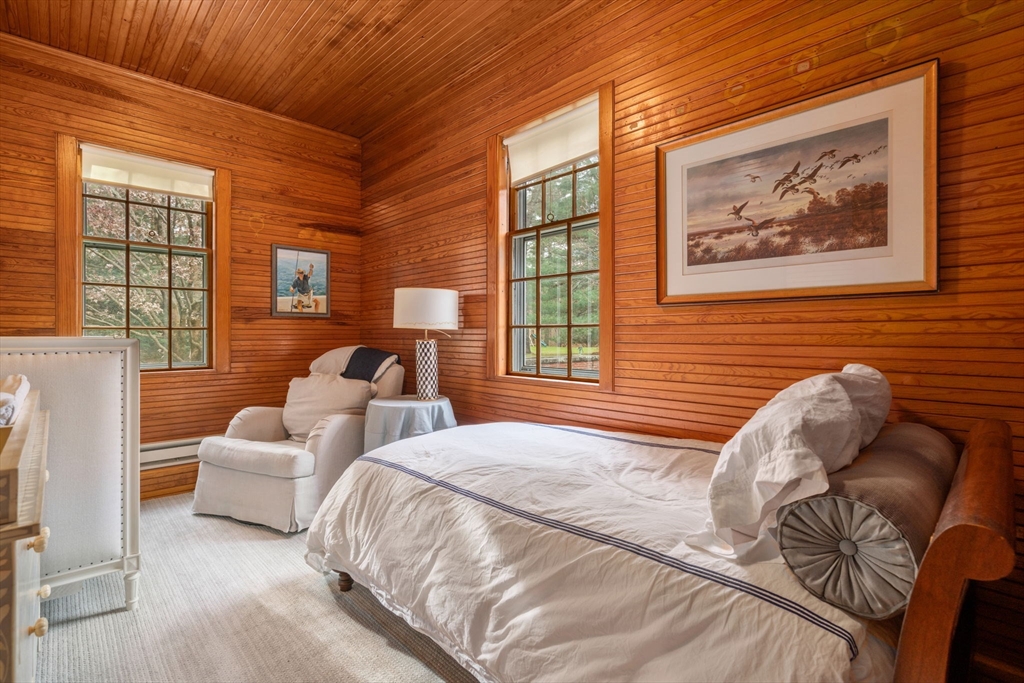 164 Forest Street, Unit 164 Sherborn, MA 01770 - Photo 21 of 32 a bedroom with bed and a couch