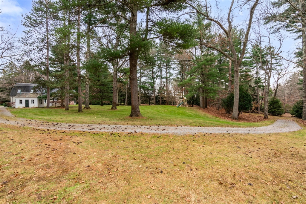 164 Forest Street, Unit 164 Sherborn, MA 01770 - Photo 30 of 32 a view of a house with a yard
