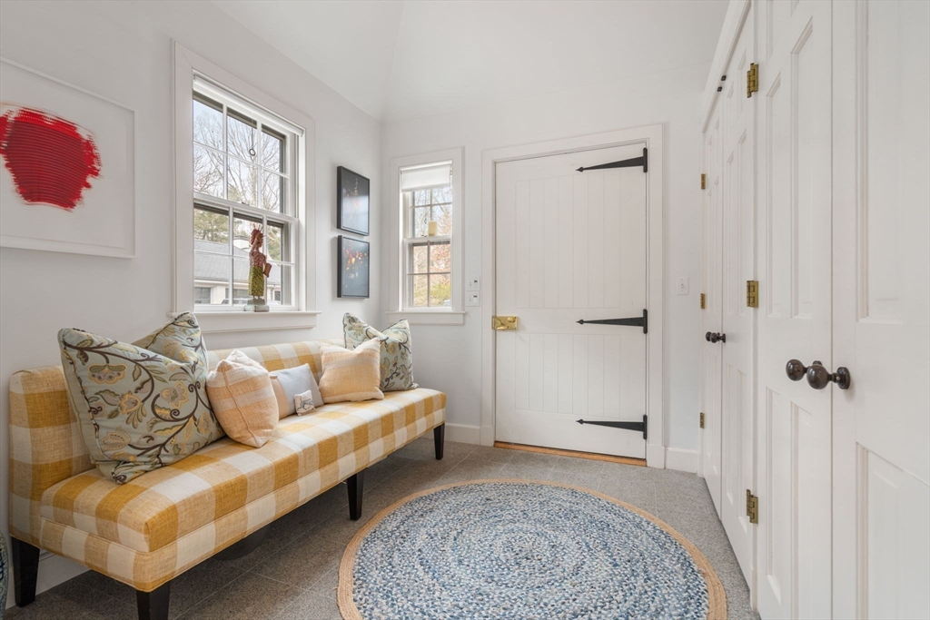 164 Forest Street, Unit 164 Sherborn, MA 01770 - Photo 4 of 32 a living room with furniture and a rug