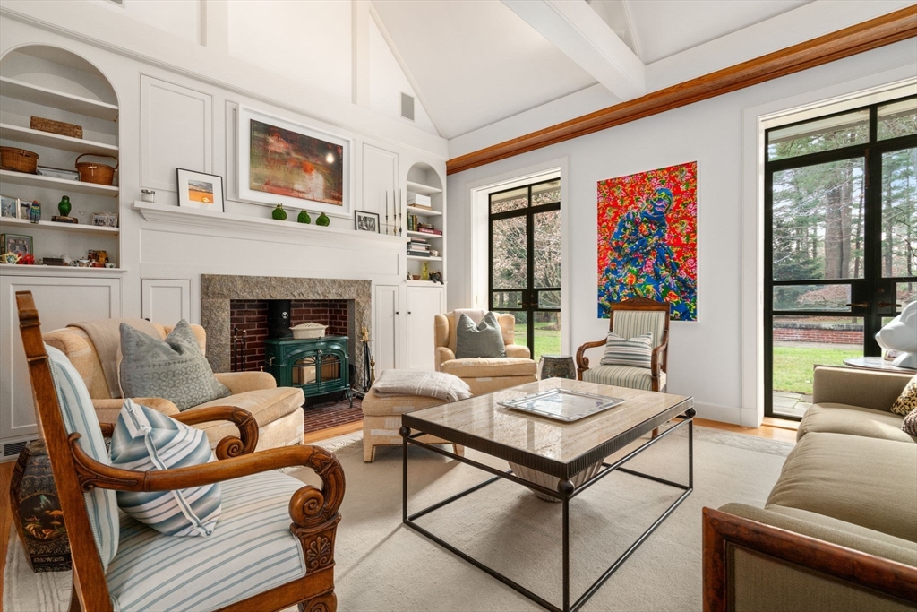 164 Forest Street, Unit 164 Sherborn, MA 01770 - Photo 5 of 32 a living room with furniture and a fireplace