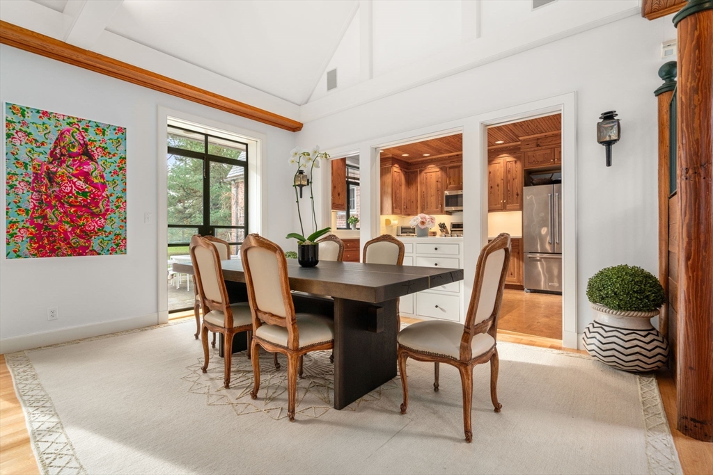 164 Forest Street, Unit 164 Sherborn, MA 01770 - Photo 7 of 32 a view of a dining room with furniture window and outside view
