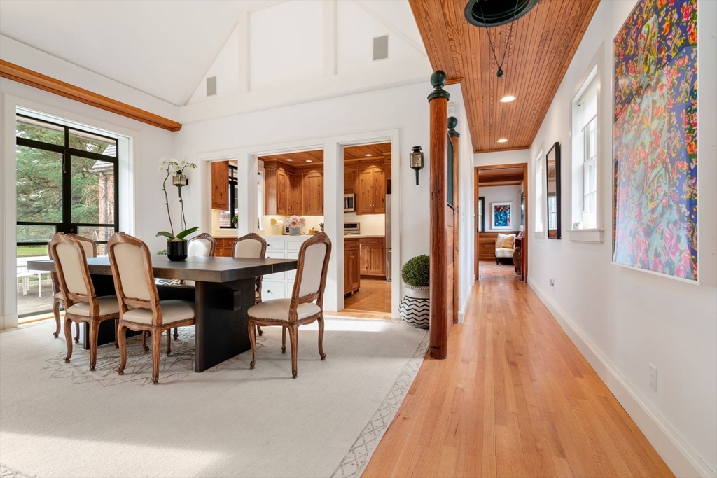 164 Forest Street, Unit 164 Sherborn, MA 01770 - Photo 8 of 32 a view of a dining room with furniture and wooden floor