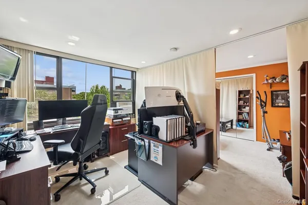 a workspace with furniture and a window