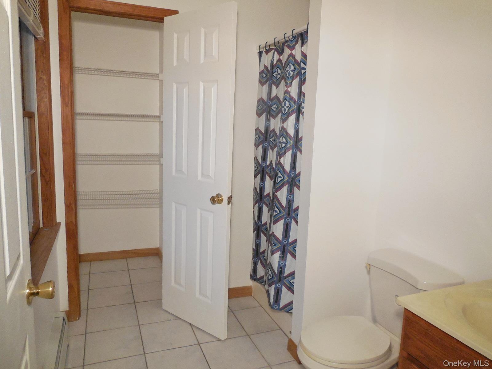 617 Burlingham Road Bloomingburg, NY 12721 - Photo 15 of 39 Private bath with good size linen closet, shower, tiled floor and lots of light.