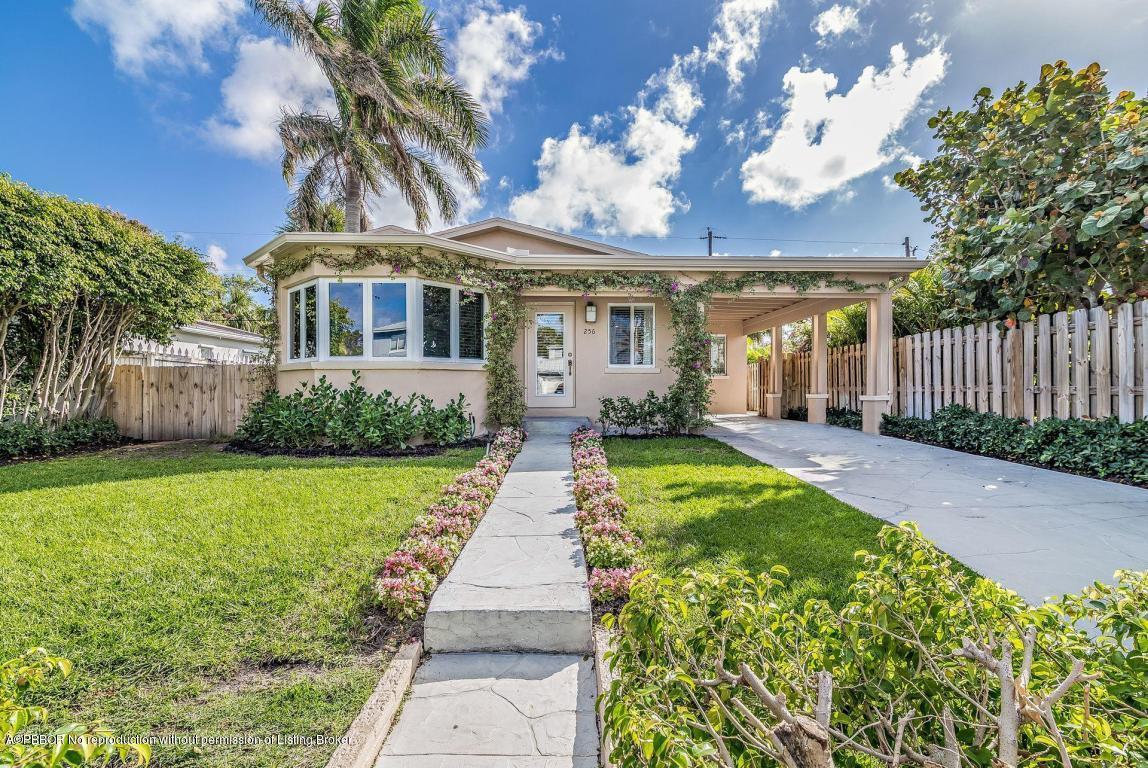 256 Alpine Road West Palm Beach, FL 33405 - Photo 2 of 26 a front view of a house with a yard