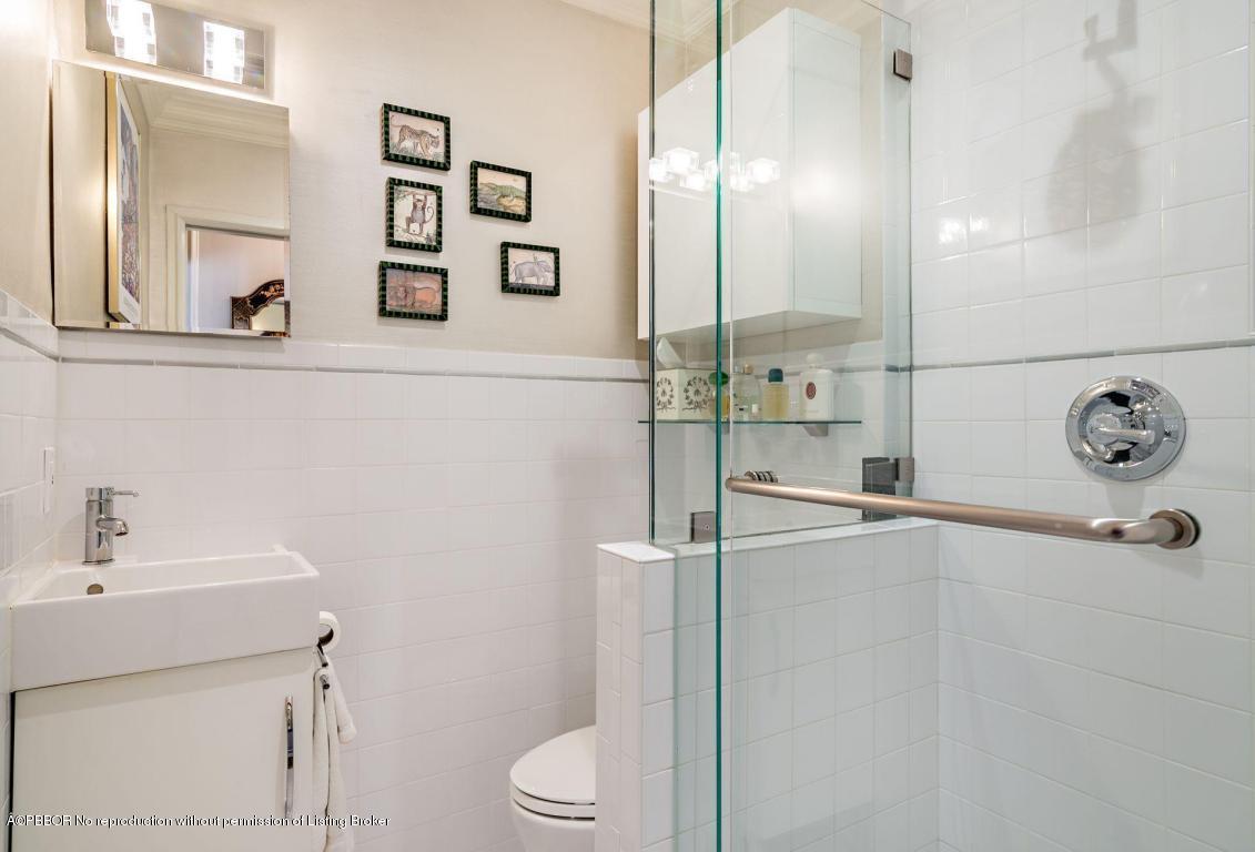 256 Alpine Road West Palm Beach, FL 33405 - Photo 12 of 26 a bathroom with a sink a toilet and shower