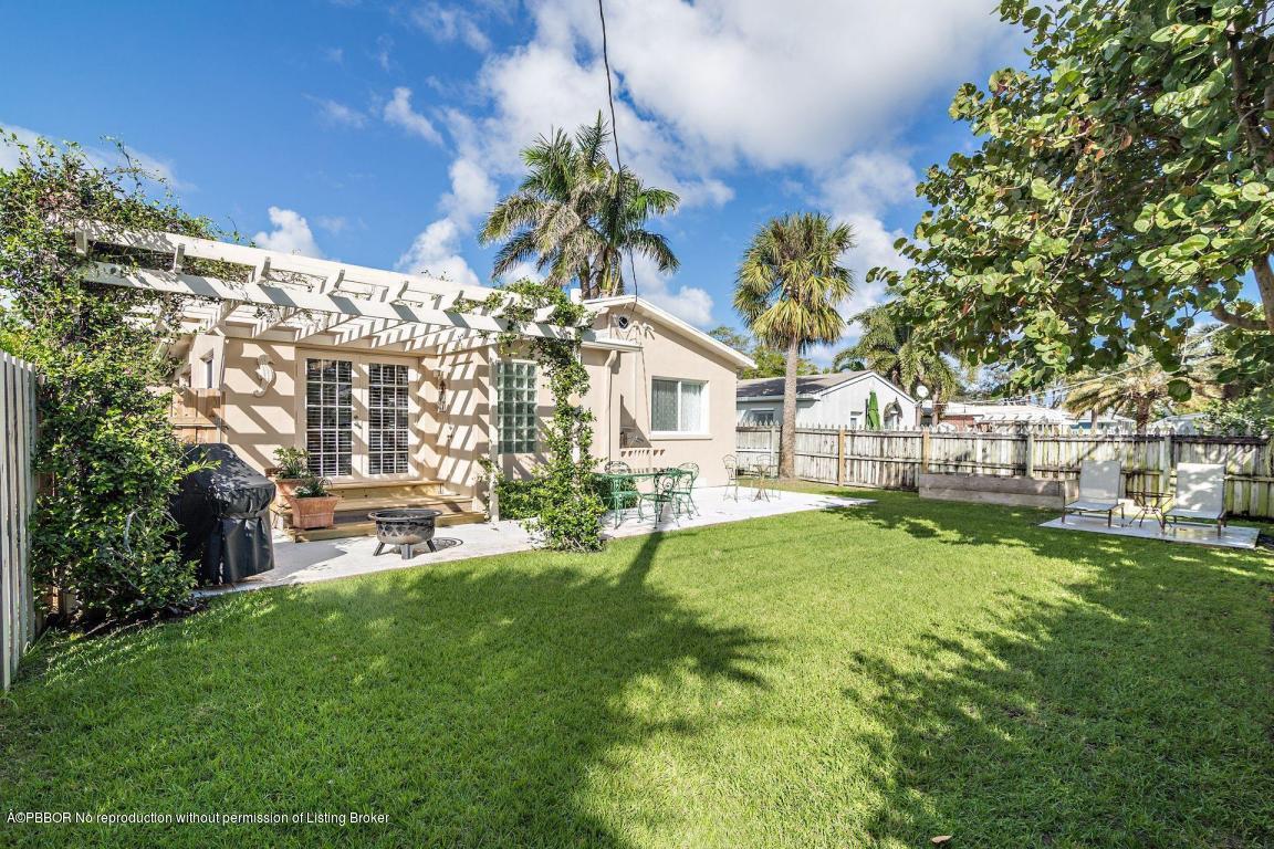 256 Alpine Road West Palm Beach, FL 33405 - Photo 14 of 26 a view of house with backyard and sitting area