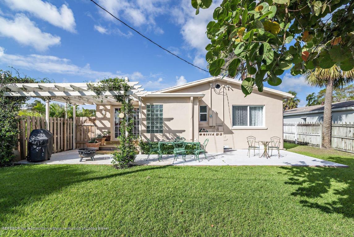 256 Alpine Road West Palm Beach, FL 33405 - Photo 15 of 26 a view of a house with backyard sitting area and garden