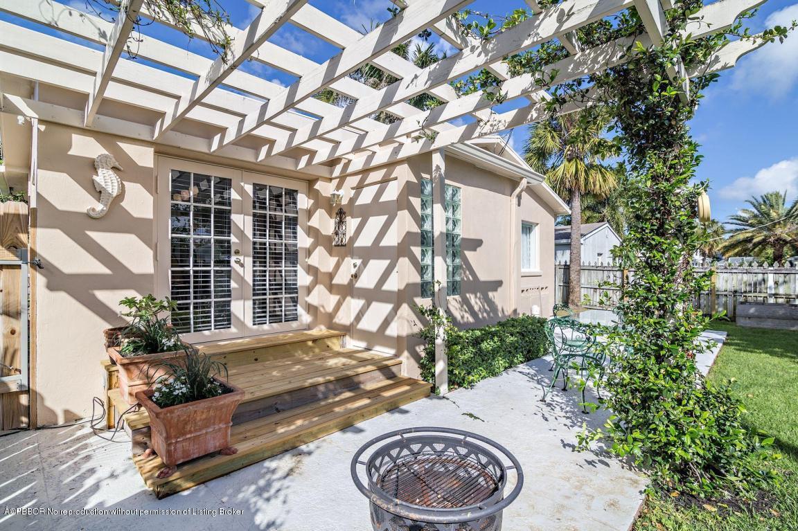 256 Alpine Road West Palm Beach, FL 33405 - Photo 17 of 26 a view of a house with a backyard