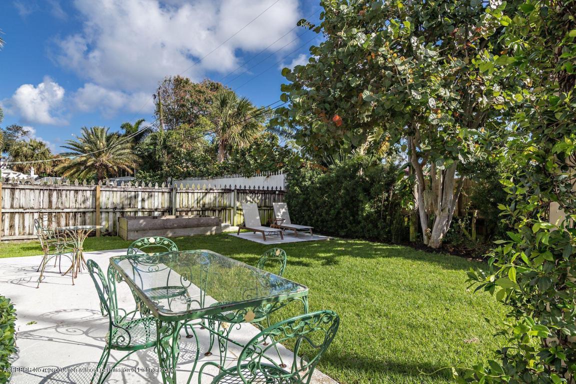 256 Alpine Road West Palm Beach, FL 33405 - Photo 19 of 26 a view of backyard with swimming pool and seating space