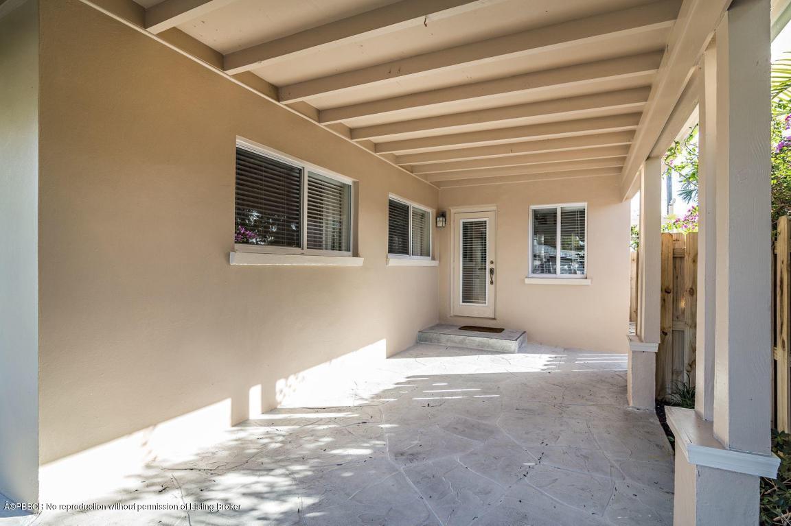 256 Alpine Road West Palm Beach, FL 33405 - Photo 20 of 26 a view of an empty room with wooden floor and a window