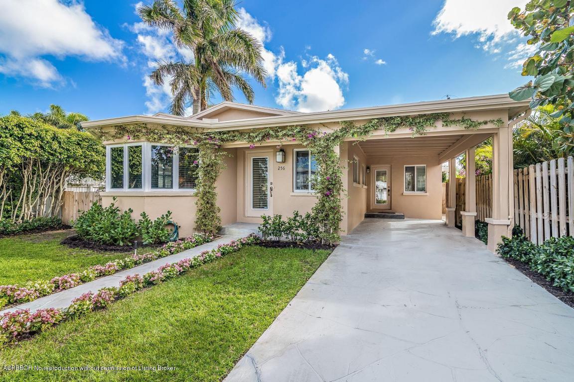 256 Alpine Road West Palm Beach, FL 33405 - Photo 3 of 26 a view of a house with a yard and plants