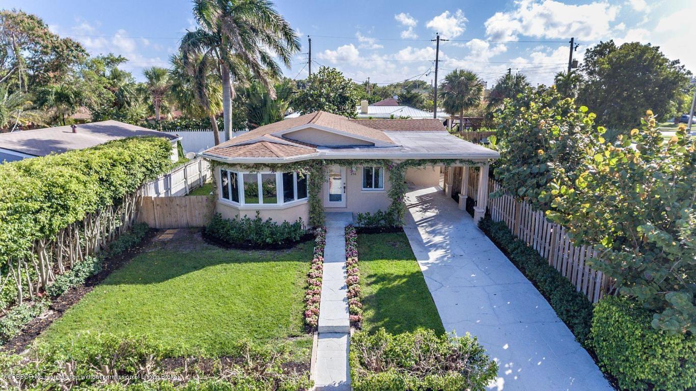 256 Alpine Road West Palm Beach, FL 33405 - Photo 22 of 26 a front view of a house with garden