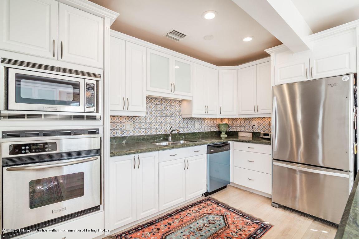 256 Alpine Road West Palm Beach, FL 33405 - Photo 7 of 26 a kitchen with granite countertop a refrigerator stove and sink