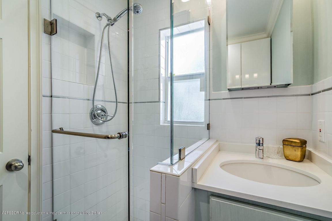 256 Alpine Road West Palm Beach, FL 33405 - Photo 10 of 26 a bathroom with a sink and a mirror