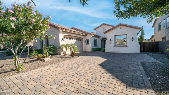 a row of palm trees in front of house
