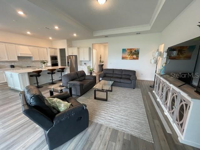 5936 Southwest 90th Court Road Ocala, FL 34481 - Photo 13 of 28 a living room with furniture and a flat screen tv