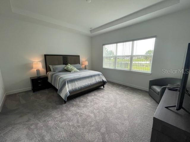 5936 Southwest 90th Court Road Ocala, FL 34481 - Photo 16 of 28 a bedroom with a bed and a chair