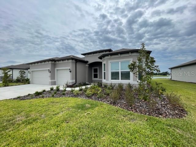 5936 Southwest 90th Court Road Ocala, FL 34481 - Photo 2 of 28 a front view of house with yard and green space