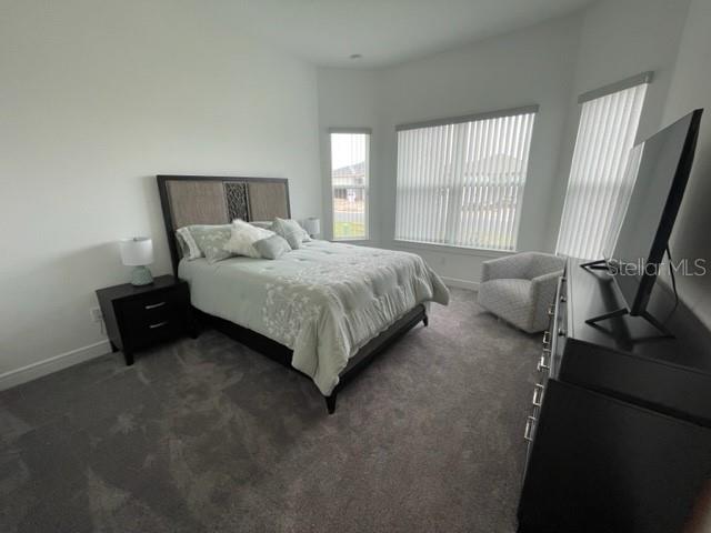 5936 Southwest 90th Court Road Ocala, FL 34481 - Photo 23 of 28 a bedroom with a bed chair and window