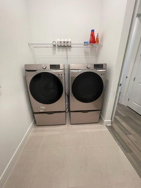 5936 Southwest 90th Court Road Ocala, FL 34481 - Photo 25 of 28 a utility room with dryer and washer