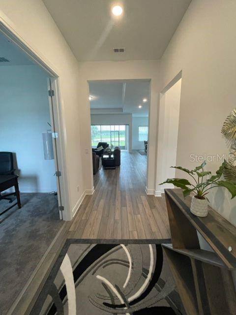 5936 Southwest 90th Court Road Ocala, FL 34481 - Photo 4 of 28 a room with wooden floor and furniture