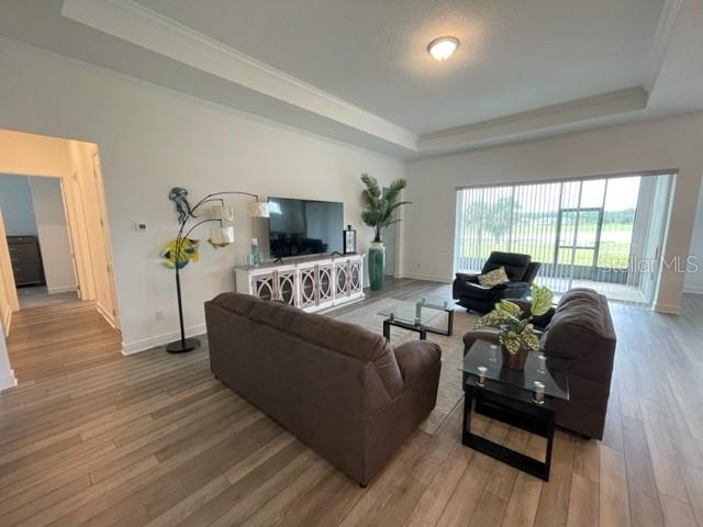 5936 Southwest 90th Court Road Ocala, FL 34481 - Photo 6 of 28 a living room with furniture and a large window