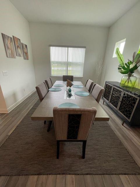 5936 Southwest 90th Court Road Ocala, FL 34481 - Photo 10 of 28 a view of a dining room with furniture
