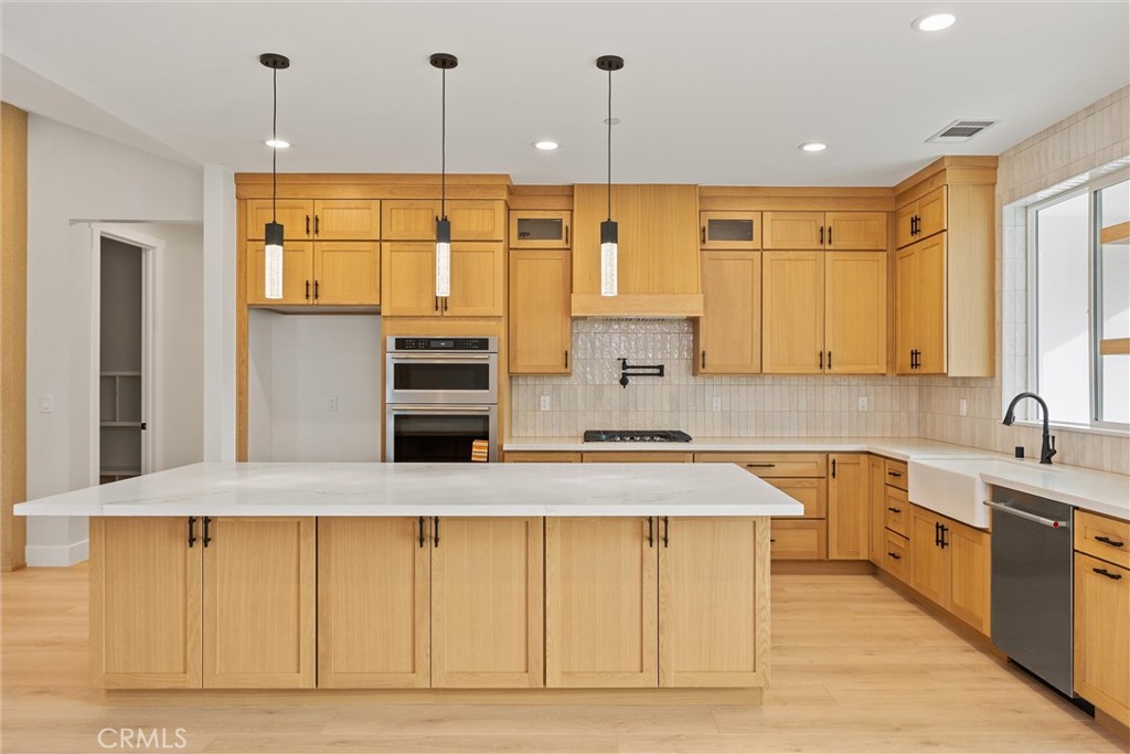 6006 Kibler Road Paradise, CA 95969 - Photo 13 of 43 a kitchen with kitchen island a stove a sink and a refrigerator