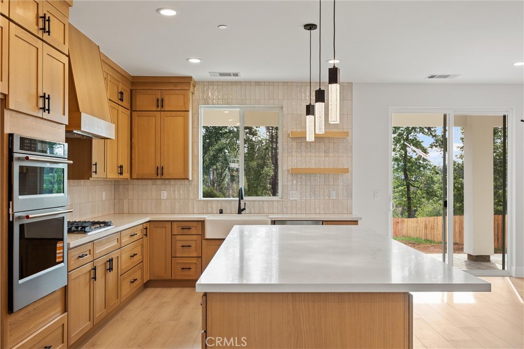 6006 Kibler Road Paradise, CA 95969 - Photo 15 of 43 a kitchen with stainless steel appliances granite countertop a sink and a stove