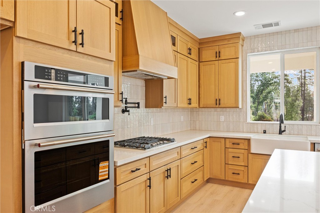 6006 Kibler Road Paradise, CA 95969 - Photo 16 of 43 a kitchen with granite countertop cabinets stainless steel appliances and a sink