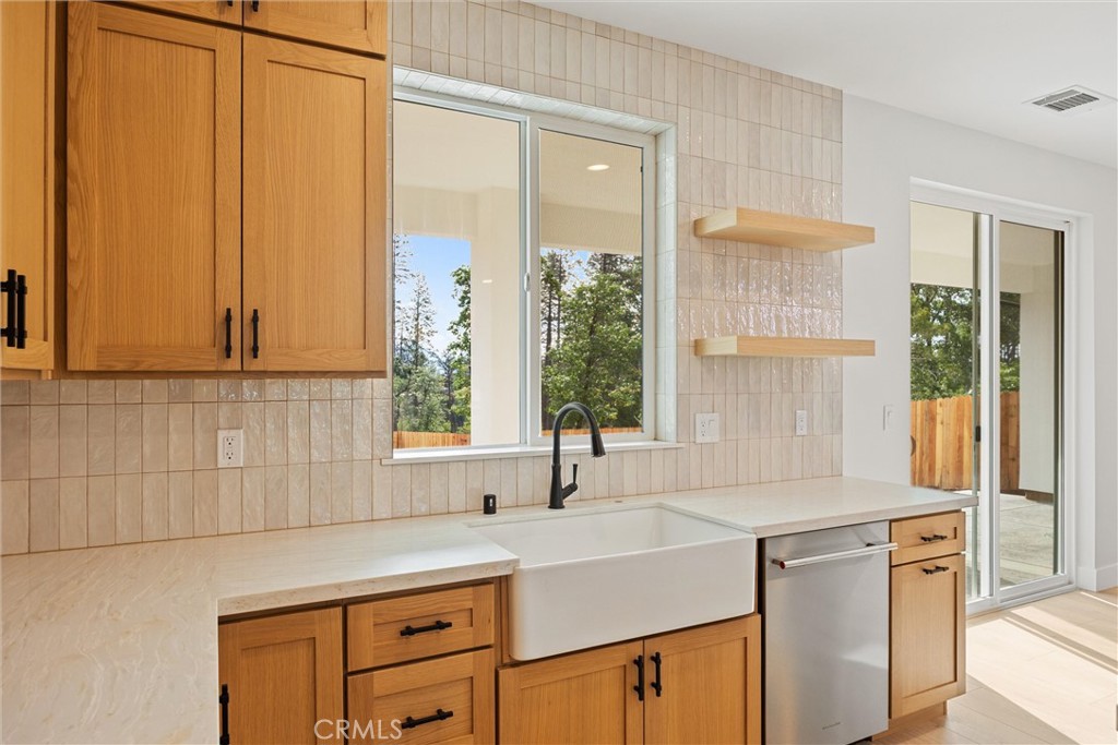 6006 Kibler Road Paradise, CA 95969 - Photo 18 of 43 a kitchen with stainless steel appliances a sink a stove and a refrigerator