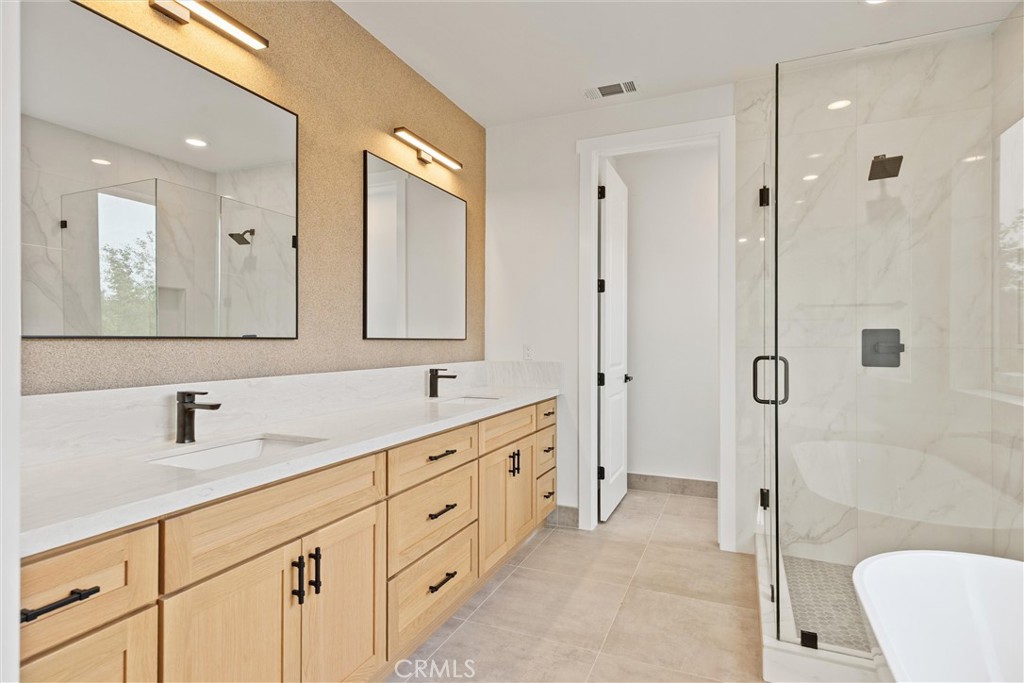 6006 Kibler Road Paradise, CA 95969 - Photo 26 of 43 a bathroom with a double vanity sink mirror double and shower