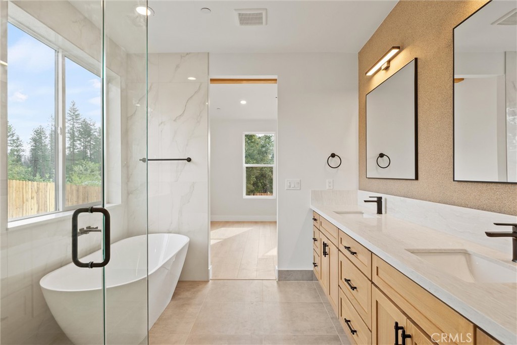 6006 Kibler Road Paradise, CA 95969 - Photo 27 of 43 a bathroom with a granite countertop sink mirror and bathtub