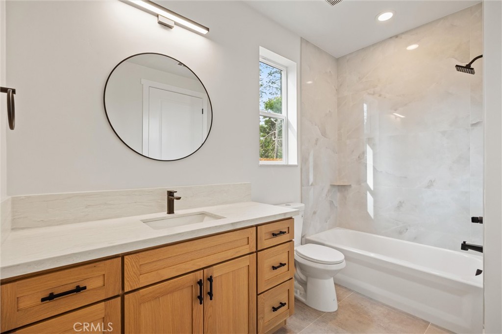 6006 Kibler Road Paradise, CA 95969 - Photo 33 of 43 a bathroom with a granite countertop toilet a sink and a bathtub