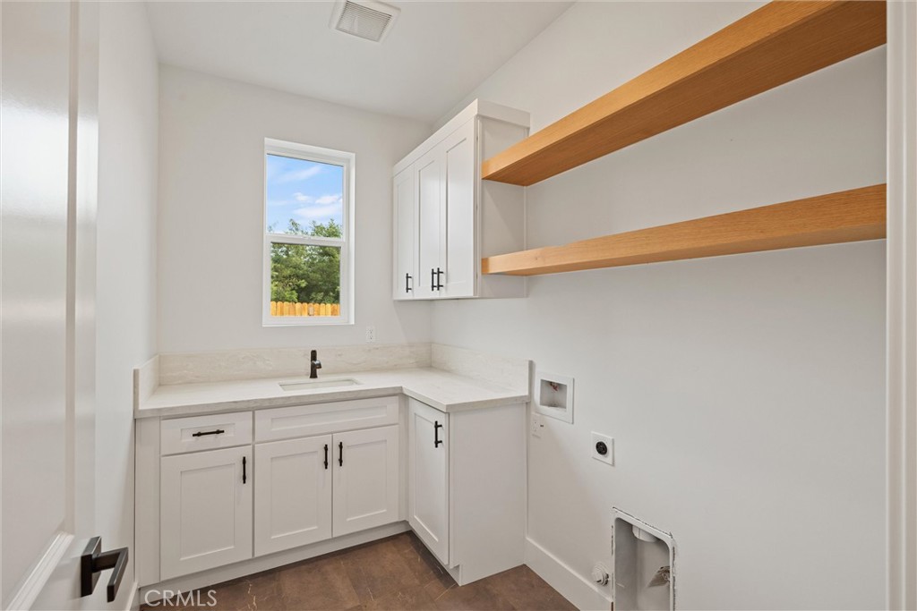 6006 Kibler Road Paradise, CA 95969 - Photo 34 of 43 a view of a kitchen with cabinets appliances a sink and a window