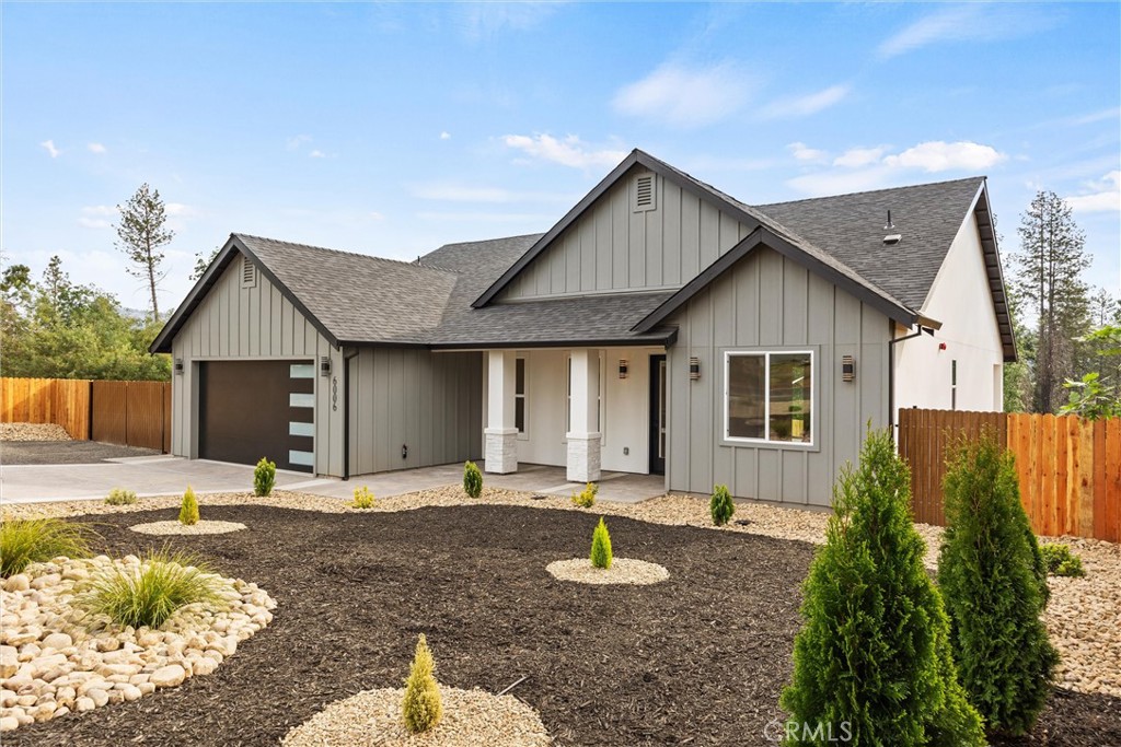 6006 Kibler Road Paradise, CA 95969 - Photo 4 of 43 a front view of house with yard and trees in the background