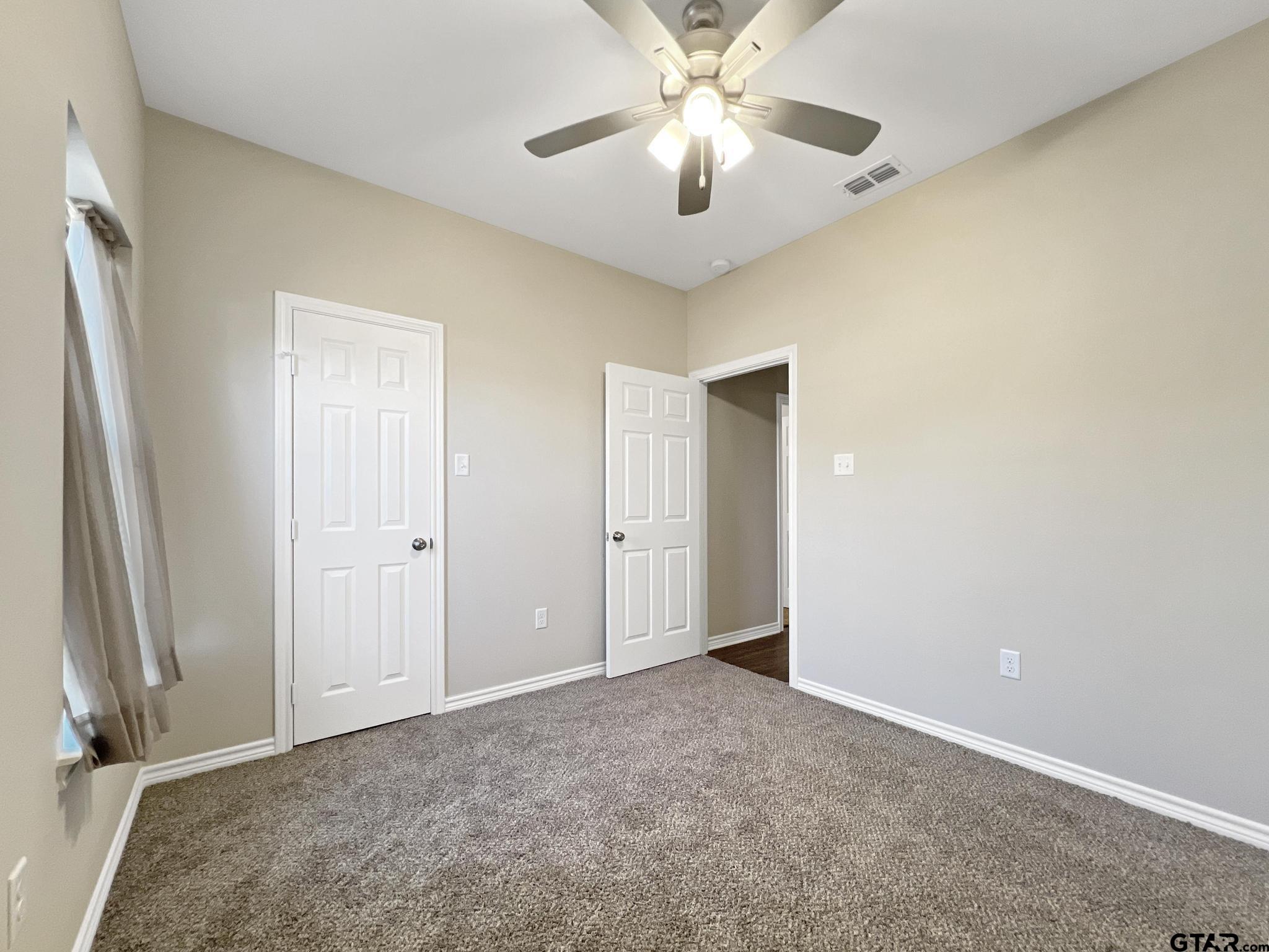 107 Short Street Gilmer, TX 75645 - Photo 15 of 26 wooden floor in an empty room