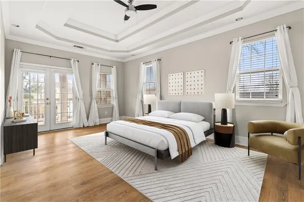 a spacious bedroom with a bed and glass window
