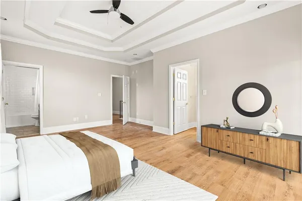 a spacious bedroom with a bed and cabinets