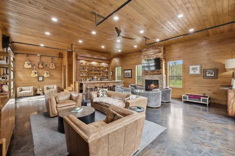 a living room with furniture and a flat screen tv