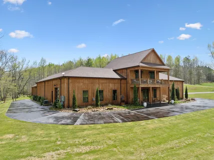 a kitchen with stainless steel appliances granite countertop a refrigerator and a stove