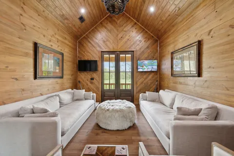 a front view of a house with a yard table and chairs