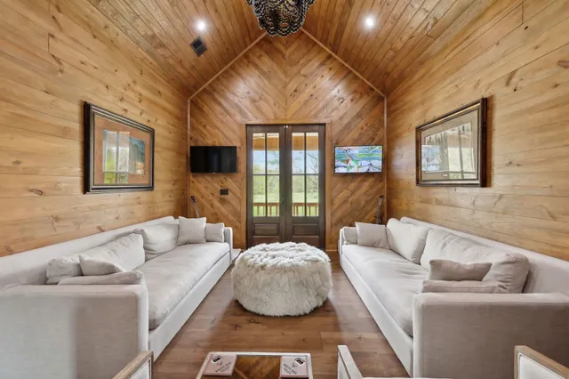 a front view of a house with a yard table and chairs