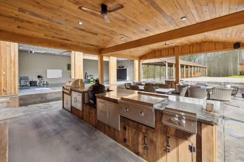 a bathroom with a sink a toilet and shower curtain