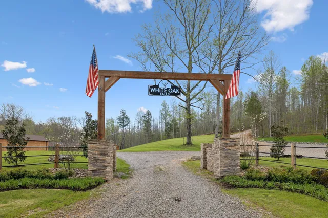 a kitchen with a table chairs stove and granite counter top