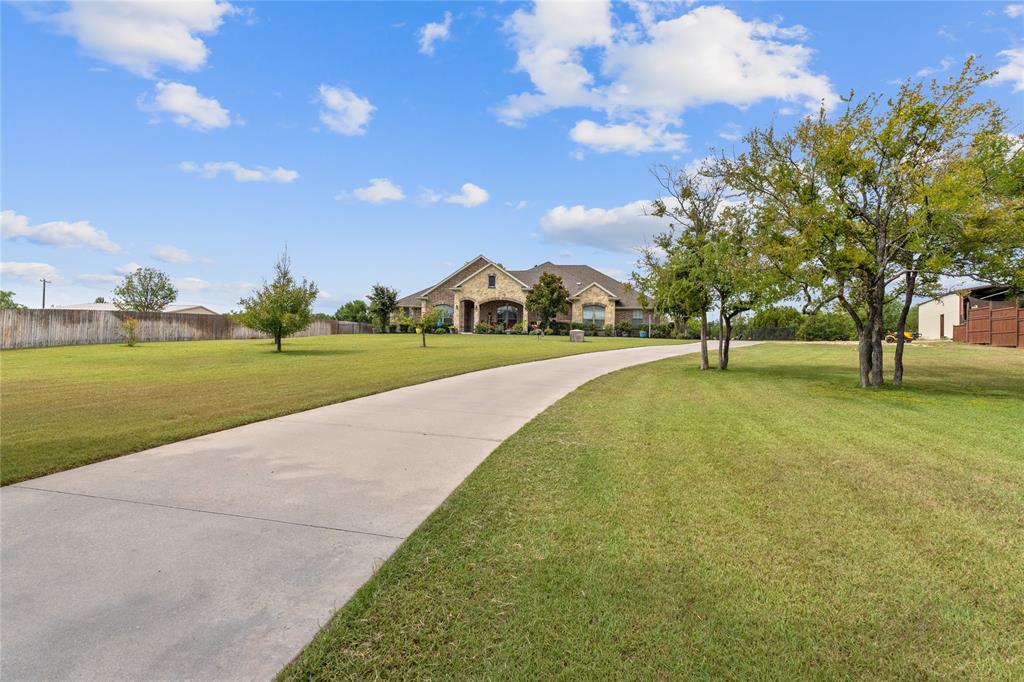 5965 Feather Wind Way Fort Worth, TX 76135 - Photo 3 of 35 a view of outdoor space with garden and trees