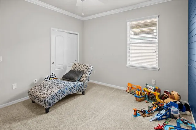 a room with toys and dresser