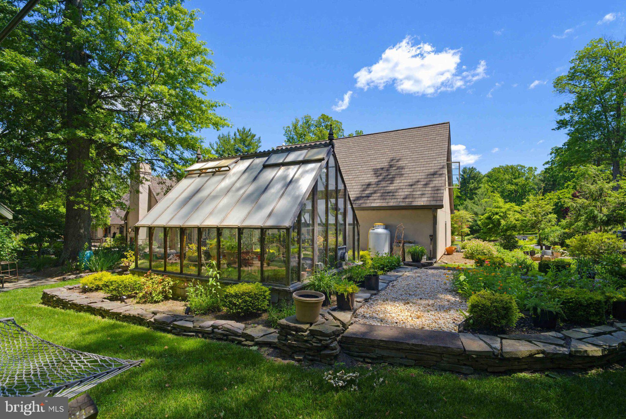 2244 Deer Path Road Huntingdon Valley, PA 19006 - Photo 82 of 95 Lush garden oasis with a glasshouse.