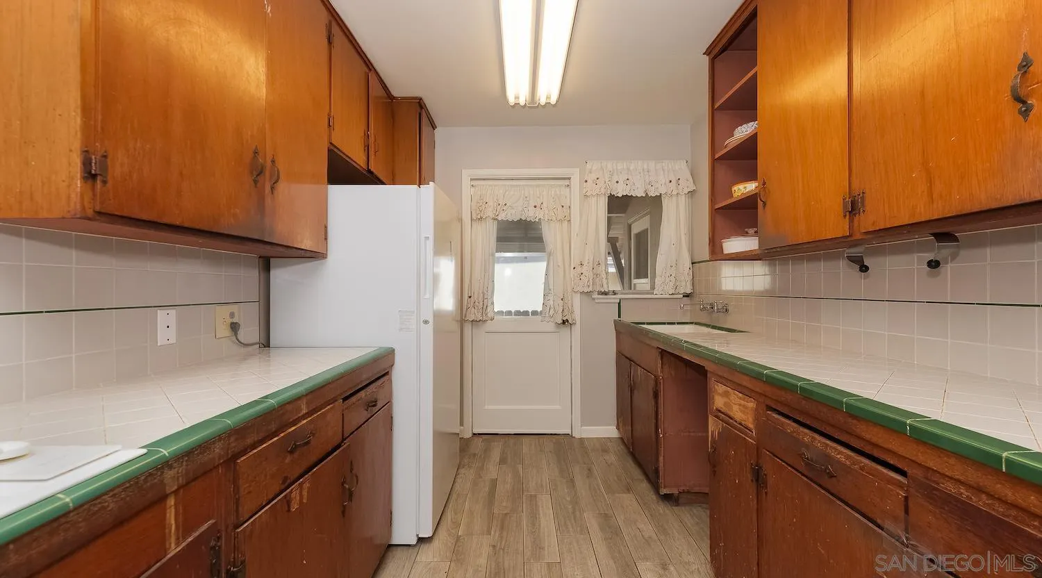 1003 Tiger Tail Road Vista, CA 92084 - Photo 11 of 22 a kitchen with a sink and cabinets
